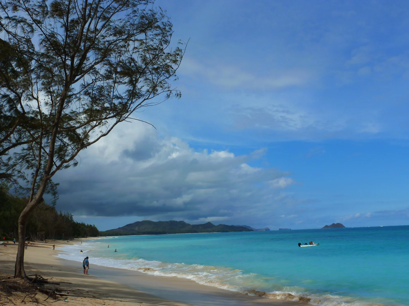 Blue water and a sandy shoreline across Waimānalo Bay