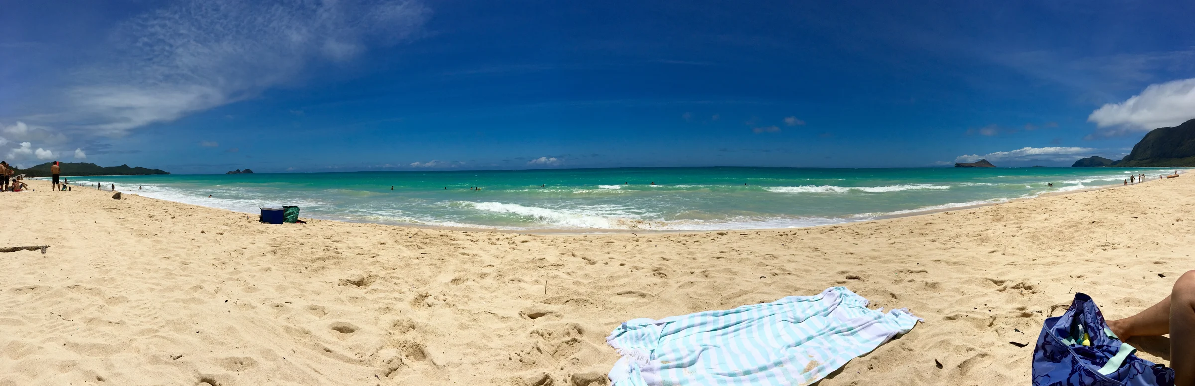 Panoramic view of sand and turquoise water along Waimānalo Beach on Oʻahu